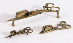Three miniature 19th century brass candle-snuffers, English Including two toy examples, each of