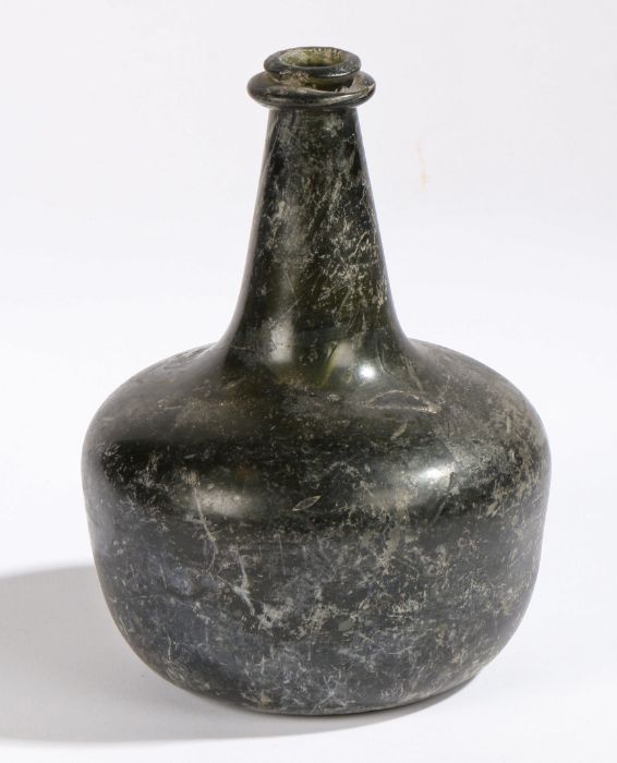 An early 18th century glass onion bottle, English, 1700-1720 Dark blue glass, inverted pontil mark - Image 2 of 2