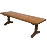 A beech trestle table In the 16th century manner, having an end-cleated top of two thick boards,