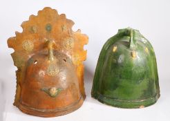 Two 18th century Dutch curfews or fire guards One in orange glaze, with embossed medallions of
