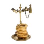 A brass wax-jack, probably early -mid 19th century, English Designed for a pre-coiled taper, dropped