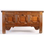 An oak boarded coffer, German, circa 1700-40 Having an impressive one-piece top with ovolo-moulded