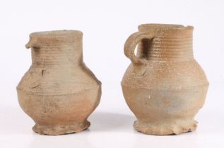 Two 16th century German Sieburg pottery jugs With ring decoration to the bulbous bodies, one lacking