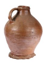 A large 16th century German medieval stoneware jug, circa 1500 - 1550 With a short neck body above a
