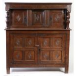 An early 17th century oak court cupboard, English, circa 1600-30 With simple moulded cornice, and