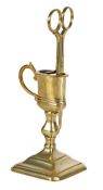 A good George I brass upright candle-snuffer and stand, circa 1720 The snuffer, or wick trimmer,