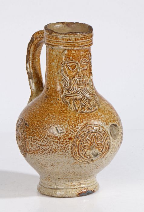 A 17th century salt glazed Bellarmine With a bearded mask above three flower head panels to the - Image 2 of 2