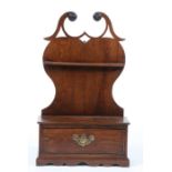 A George III cherrywood mural spoon rack The heart-shaped backplate with a fretwork broken swan-neck