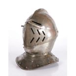 A Cuirassier iron Close-Helmet, English or French, in the early 17th century manner With rounded