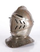 A Cuirassier iron Close-Helmet, English or French, in the early 17th century manner With rounded