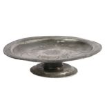 A rare Charles II pewter wrigglework footed plate or tazza, circa 1685 The plate with narrow
