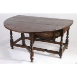 A large oak gateleg table, English, circa 1700 Having an oval drop-leaf top, and single end-frieze