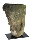 An unusual carved Medieval stone head The top hollowed out for offerings, above a bearded face, 40cm
