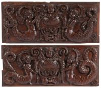 A pair of 17th century oak panels, dated 1662 Each designed with a pair of mermaids, centred by a