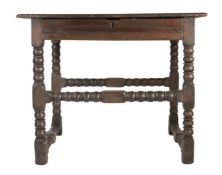 A Charles II oak side table, circa 1670 Having a boarded top with ovolo-moulded edge, and flat run-