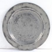 A rare William & Mary/Queen Anne small pewter plate/paten, circa 1700-10 Having a plain rim and flat