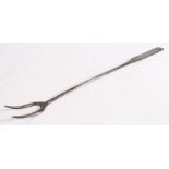 A George II iron meat fork, circa 1750 With two tines, plain stem and flattened handle with