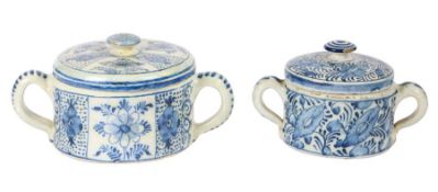 Two 18th century Dutch Delft posset pots The first decorated with foliate panels and loop handles,