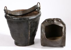 An early 19th century leather fire bucket, English, circa 1800 Having a stitched bulging rim and