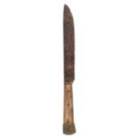 A mid-15th century table knife, circa 1450 The fullered iron blade with a wooden handle and metal