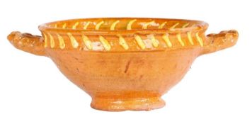 A Dutch slipware twin handled bowl, dated 1614 A central embossed bust in profile with surrounding