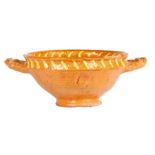 A Dutch slipware twin handled bowl, dated 1614 A central embossed bust in profile with surrounding