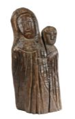 A primitive oak carving of the Virgin and child  Modelled in drapped robes, 51cm high