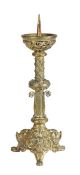 A 19th century Gothic-Revival brass candlestick The picket top above text and a pierced figural