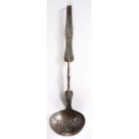 An early 18th century iron ladle, English, circa 1720 Having a large circular and deep bowl, a