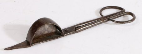 An iron candle-snuffer, English, circa 1700 Of scissor form, one blade with a pointed tip (for