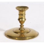 A George III brass lantern candlestick, circa 1760 Having a gently waisted socket with mid-fillet