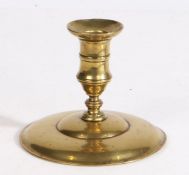 A George III brass lantern candlestick, circa 1760 Having a gently waisted socket with mid-fillet