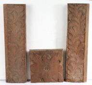 Three 17th Century oak panels To include a pair carved as trailing leaves, 46cm long, together