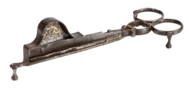 A rare pair of iron and damascene decorated candle-snuffers, circa 1700 One blade with square-end