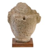 A carved stone urn or finial, probably Medieval, Northern France Raised on a square metal plinth,