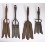 A collection of four 19th century iron eel forks Each example with three blades and socket ends,