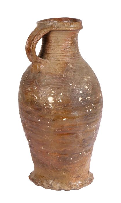 A 16th century German stoneware  jug, circa 1500 With a ribbed body and loop handle to the bulbous