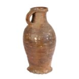 A 16th century German stoneware  jug, circa 1500 With a ribbed body and loop handle to the bulbous