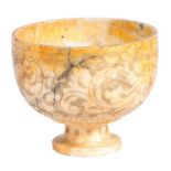 An 18th century marble bowl, probably Italian Etched with a scrolling cloud design, on a dumpy