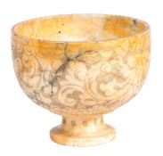 An 18th century marble bowl, probably Italian Etched with a scrolling cloud design, on a dumpy