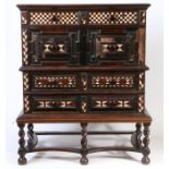 A striking Charles II oak, fruitwood-veneered and bone-inlaid chest-on-stand, circa 1670 The chest