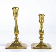Two early 18th century brass candlesticks, English, circa 1720 Both seamed, with balustroid stem and