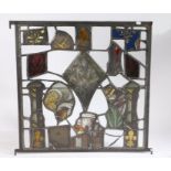 A stained glass panel Made using Medieval stained glass elements, depicting a tower, fleur-de-lys, a