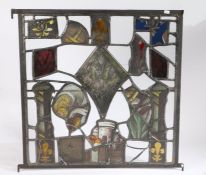 A stained glass panel Made using Medieval stained glass elements, depicting a tower, fleur-de-lys, a