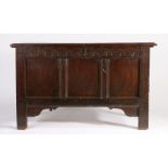 A Charles I joined oak coffer, circa 1640 Having a triple-boarded lid with ovolo-moulded edge, the