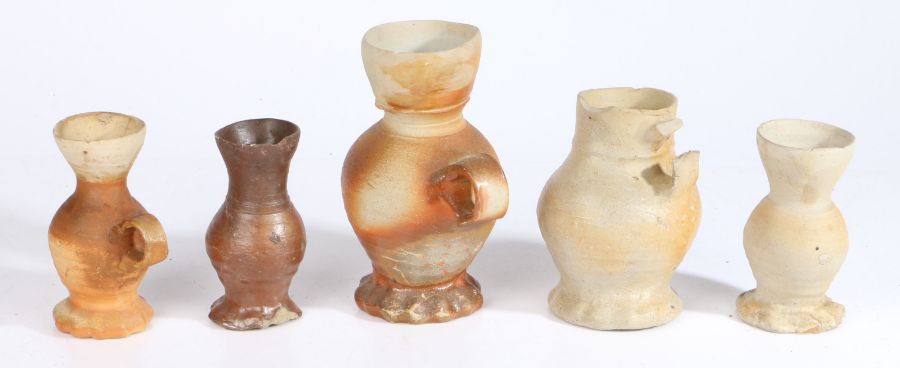 A collection of 16th & 17th century pottery To include jugs with flared lips and ribbed bodies,