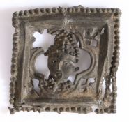 A 14th century pewter pilgrim badge, English Of square form, designed with the head of Thomas