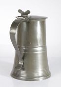 A late George III pewter flat-lid flagon, Scottish, circa 1820 The slightly domed-lid with locator