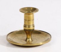 A George III cast brass lantern candlestick, circa 1800 The straight-sided socket with a flared