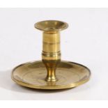 A George III cast brass lantern candlestick, circa 1800 The straight-sided socket with a flared